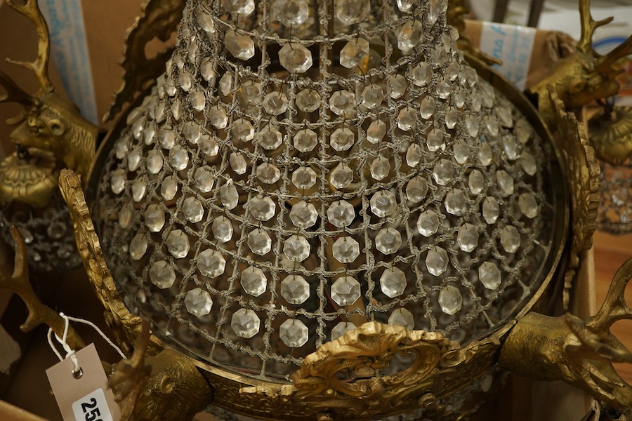 A large five light basket chandelier mounted with gilt metal stags heads, 90cm high